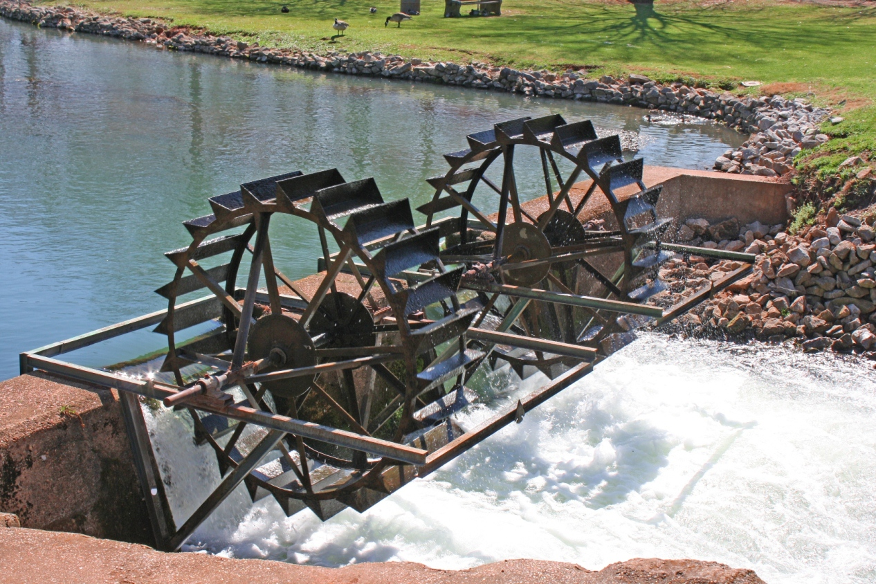 A small stone bridge with waterwheels in Spring Park.